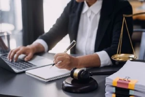 A personal injury lawyer takes notes on his laptop in his Rock Hill office.